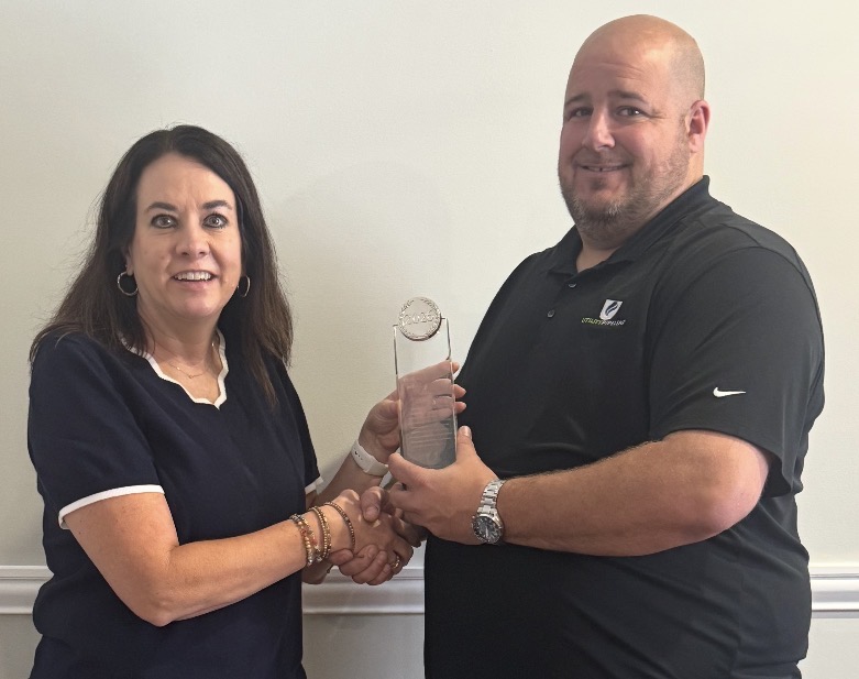 Cindy Blevins being presented her award.